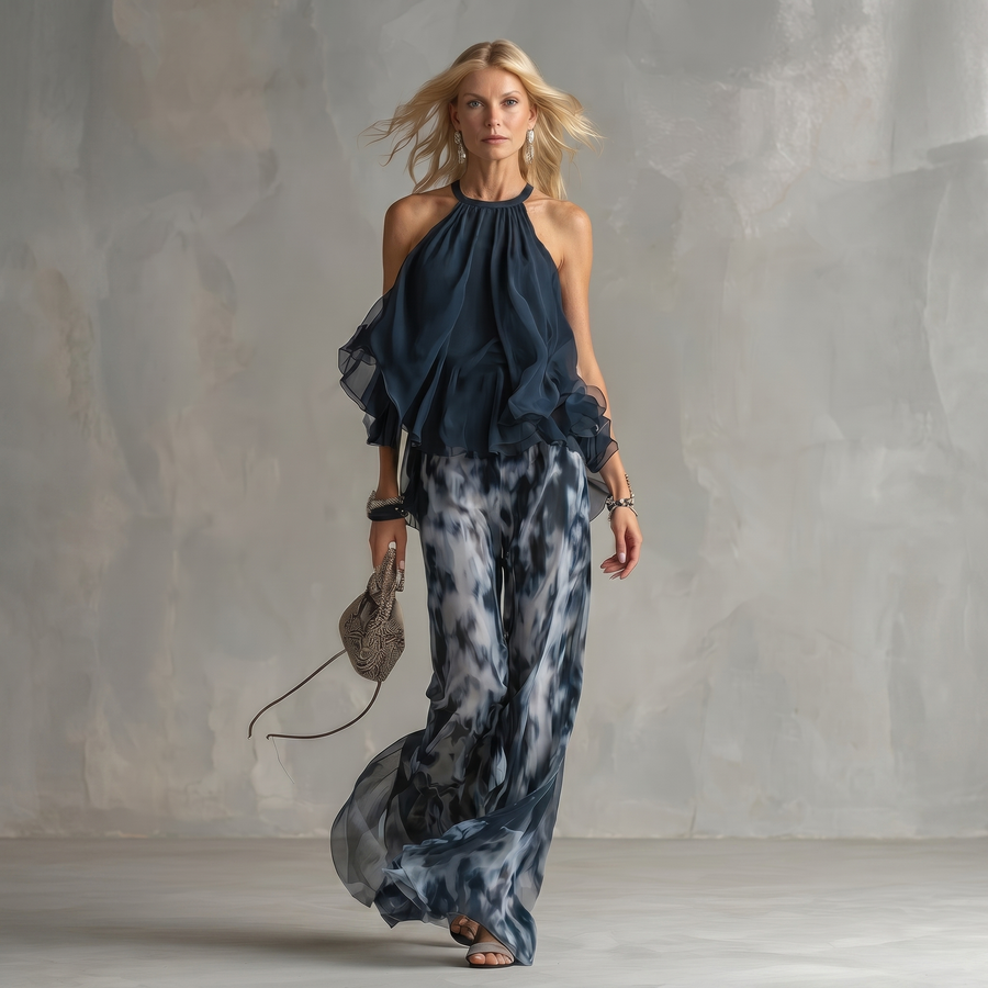 Ludovica - un elegante completo in chiffon che presenta una blusa a collo alto e pantaloni larghi stampati